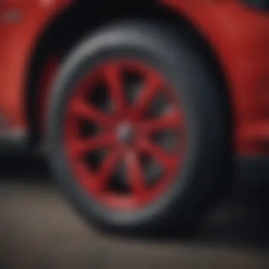 Close-up of the Mustang Mach-E Red wheels and suspension system emphasizing performance