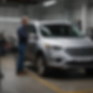 Maintenance Check on Ford Escape Hybrid Mechanic inspecting a Ford Escape Hybrid during maintenance