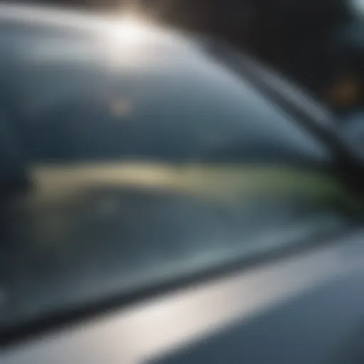 Close-up view of a windshield with clear UV tint reflecting sunlight