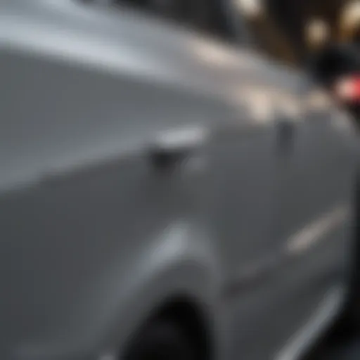 Close-up of a dented car door before repair