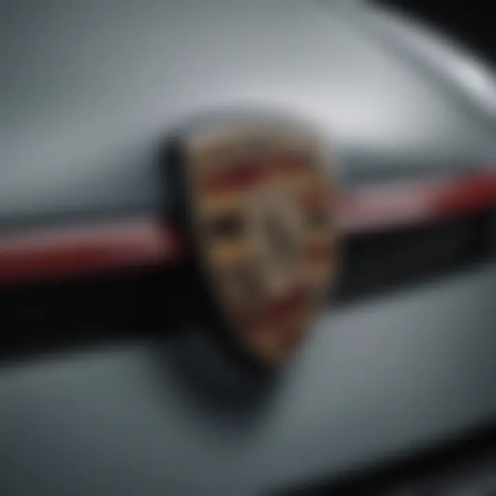 A close-up of a Porsche emblem, representing the brand's heritage and prestige.