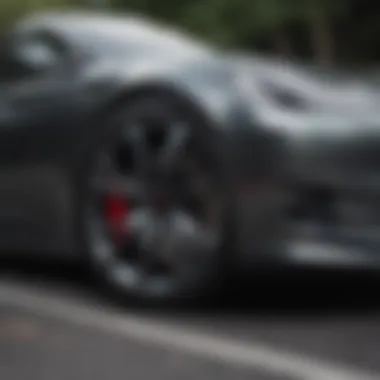 Tesla vehicle on the road with aero rims in action