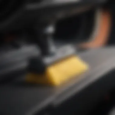 Close-up of a high-tech dust cleaner attachment designed for vehicle interiors.